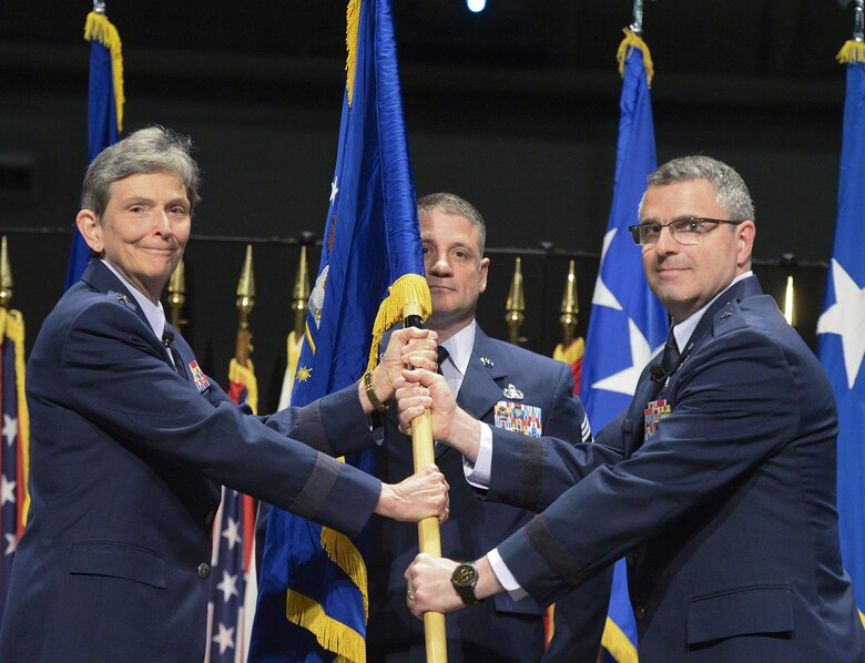 Brig. Gen. William T. Cooley assumes command of the Air Force Research Laboratory headquartered at Wright Patterson AFB, Ohio, from Gen. Ellen M. Pawlikowski, commander, Air Force Materiel Command, during a ceremony May 2 at the National Museum of the United States Air Force. (U.S. Air Force Photo/Richard Oriez)