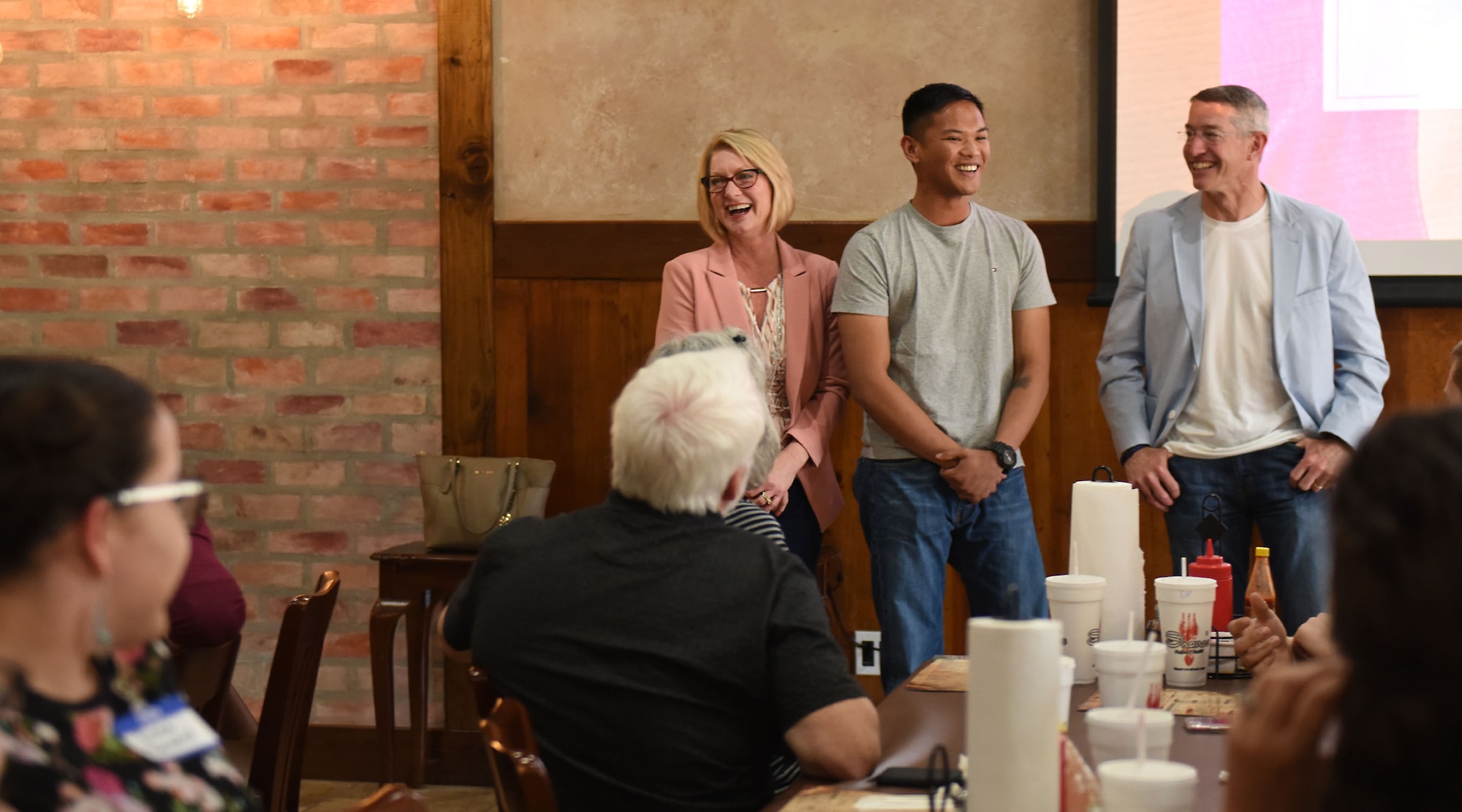 Airman 1st Class Nino Garcia, firefighter assigned to the 2nd Civil Engineer Squadron Fire Station 3, speaks about his Roots for Boots experience with his host family, Michael and Debbie Williams, at Shane’s Seafood and BBQ in Bossier City, La., April 30, 2017. The Williams and Garcia have been involved with the program since it started in 2016. (U.S. Air Force Photo/Airman 1st Class Sydney Bennett)