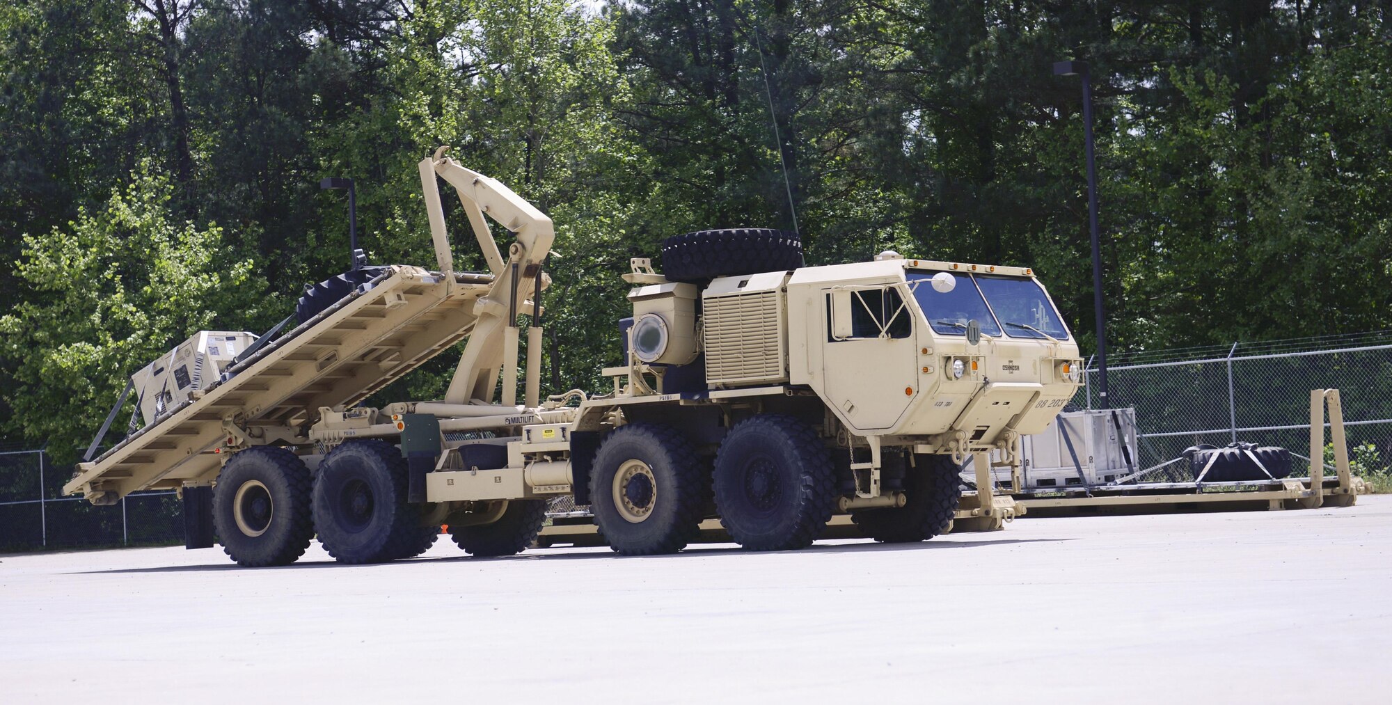 A U.S. Army Soldier with the 688th Rapid Port Opening Element uses a load handling system truck to load a pallet filled with supplies during an exercise at Joint Base Langley-Eustis, Va., April 26, 2017. Soldiers participated in the three-day exercise in preparation for an upcoming deployment. (U.S. Air Force photo/Airman 1st Class Kaylee Dubois)