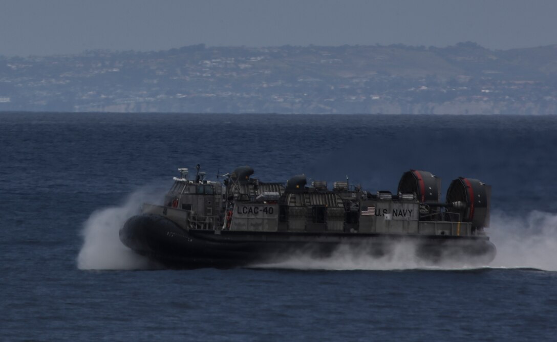 PACIFIC OCEAN, Calif., – A Landing Craft Air Cushion with Navy Assault Craft Unit 5 is piloted to the USS San Diego (LPD-22) in preparation to transport Marines and equipment with the 15th Marine Expeditionary Unit to conduct an amphibious assault during PHIBRON-MEU Integration, April 3, 2017. PMINT is the first at-sea training exercise and an opportunity for the Marines and Sailors to work as one team to complete essential missions.  This exercise lays the foundation for all the elements of the 15th MEU to develop relationships with their Navy counterparts and gain an understanding of the teamwork necessary to accomplish the mission with a focus on facilitating the integration of the blue-green team. (U.S. Marine Corps photo by Cpl. Timothy Valero)