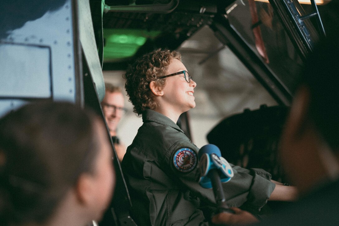 Carolyn Shaffer, Pilot for a Day participant, sits in a UH-1N Huey helicopter at Joint Base Andrews, Md., April 28, 2017. To honor and highlight Carolyn’s battle against cancer, JBA teamed up with the Check-6 Foundation, a local non-profit, to make her Pilot for a Day. (U.S. Air Force photo by Senior Airman Delano Scott)