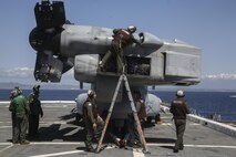 PACIFIC OCEAN, Calif., –  Marines with Marine Medium Tiltrotor Squadron 161 (Reinforced) conduct routine inspection and maintenance after a MV-22B Osprey landed on the flight deck of the USS San Diego (LPD-22) during PHIBRON-MEU Integration, April 8, 2017. PMINT is the first training period the 15th MEU and America Amphibious Ready Group team up to train for the upcoming deployment later this year. The amphibious force contains an extensive set of ship-to-shore connectors, by air or by sea, which allow the 15th MEU to move people or equipment to any corner of the world when called upon. (U.S. Marine Corps photo by Cpl. Timothy Valero)