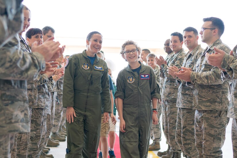 Carolyn Shaffer, right, Pilot for a Day participant, and 1st Lt. Katelyn Potts, 459th Air Refueling Wing KC-135 pilot, tours a hangar at Joint Base Andrews, Md., April 28, 2017. To honor and highlight Shaffer’s battle against cancer, JBA teamed up with the Check-6 Foundation, a local non-profit, to make her Pilot for a Day. The event is held biannually to help bring joy to the lives of children with serious illnesses. (U.S. Air Force photo by Senior Airman Delano Scott)