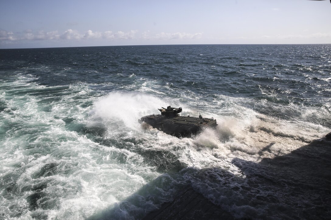 PACIFIC OCEAN, Calif., – An Assault Amphibious Vehicle with the 15th Marine Expeditionary Unit Battalion Landing Team drive off the edge of the USS SAN DIEGO’s (LPD-22) well deck to conduct amphibious training during PHIBRON-MEU Integration, April 8, 2017. PMINT is the 15th MEU’s first at-sea training exercise integrating with the Navy to accomplish mission critical tasks. The distinct ability of amphibious forces to gain access to critical areas anywhere in the world with ground, air, and logistics forces enables the Navy-Marine Corps team to shape actions across the range of military operations. (U.S. Marine Corps photo by Cpl. Timothy Valero)
