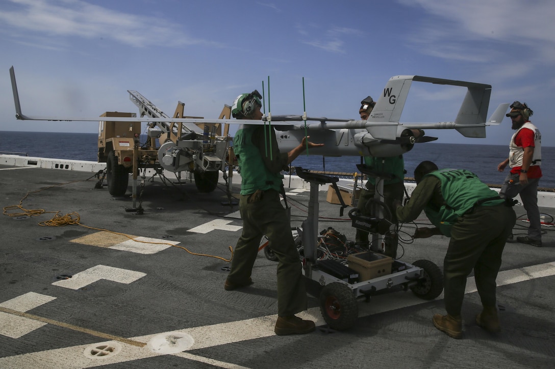 PACIFIC OCEAN, Calif., – Marines with Marine Medium Tiltrotor Squadron 161 (Reinforced) attached to the 15th Marine Expeditionary Unit load a RQ-21A Blackjack intelligence surveillance reconnaissance drone onto the launcher in preparation for its first flight during PHIBRON-MEU Integration, April 9, 2017. The RQ-21A Blackjack has the ability to collect critical information which in turn better prepares the Marines and Sailors for any mission that may occur while deployed. The 15th MEU is part of the nation’s crisis response force of choice. With the latest in technology and equipment, the MEU is capable to respond to and crisis or mission around the globe. (U.S. Marine Corps photo by Cpl. Timothy Valero)