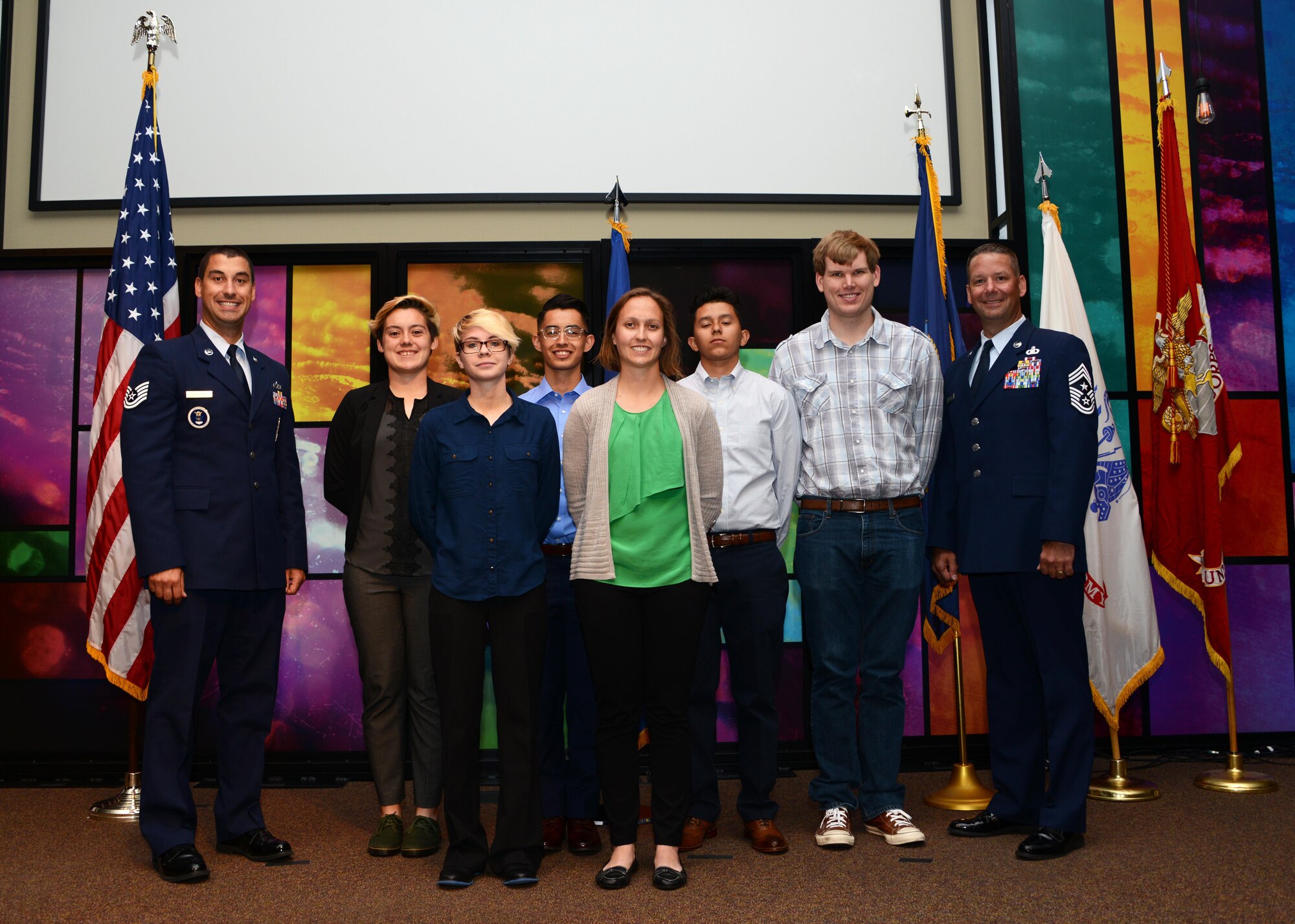 Chief Master Sgt. Randy Kwiatkoski, 56th Fighter Wing command chief, and Tech Sgt. Martin Vlacich, 362nd RCS Air Force recruiter, pose for a group photo with Air Force recruits after the 2017 Inaugural Induction Ceremony April 28, 2017, at the Calvary Community Church in Glendale, Ariz. The ceremony honored the student’s decision to serve in the United States Armed Forces upon their graduation from high school. (U.S. Air Force photo by Airman 1st Class Alexander Cook)