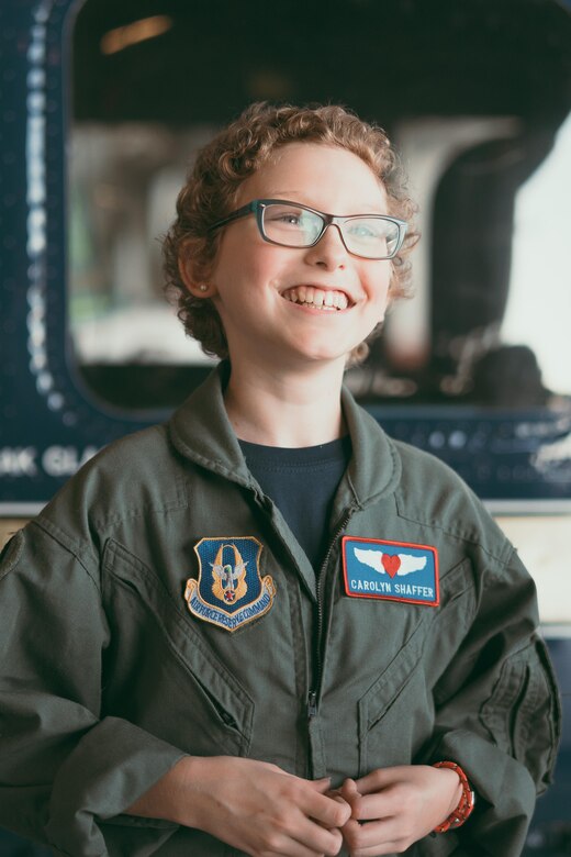 Carolyn Shaffer, Pilot for a Day participant, stands in front of a UH-1N Huey helicopter at Joint Base Andrews, Md., April 28, 2017. To honor and highlight Shaffer’s battle against cancer, JBA teamed up with the Check-6 Foundation, a local non-profit, to make her Pilot for a Day. As part of the program, Shaffer donned a personalized flight suit and flew a UH-1N Iroquois simulator, toured multiple aircraft including an F-16 Fighting Falcon and KC-135 Stratotanker, and participated in a variety of base demonstrations. (U.S. Air Force photo by Senior Airman Delano Scott)