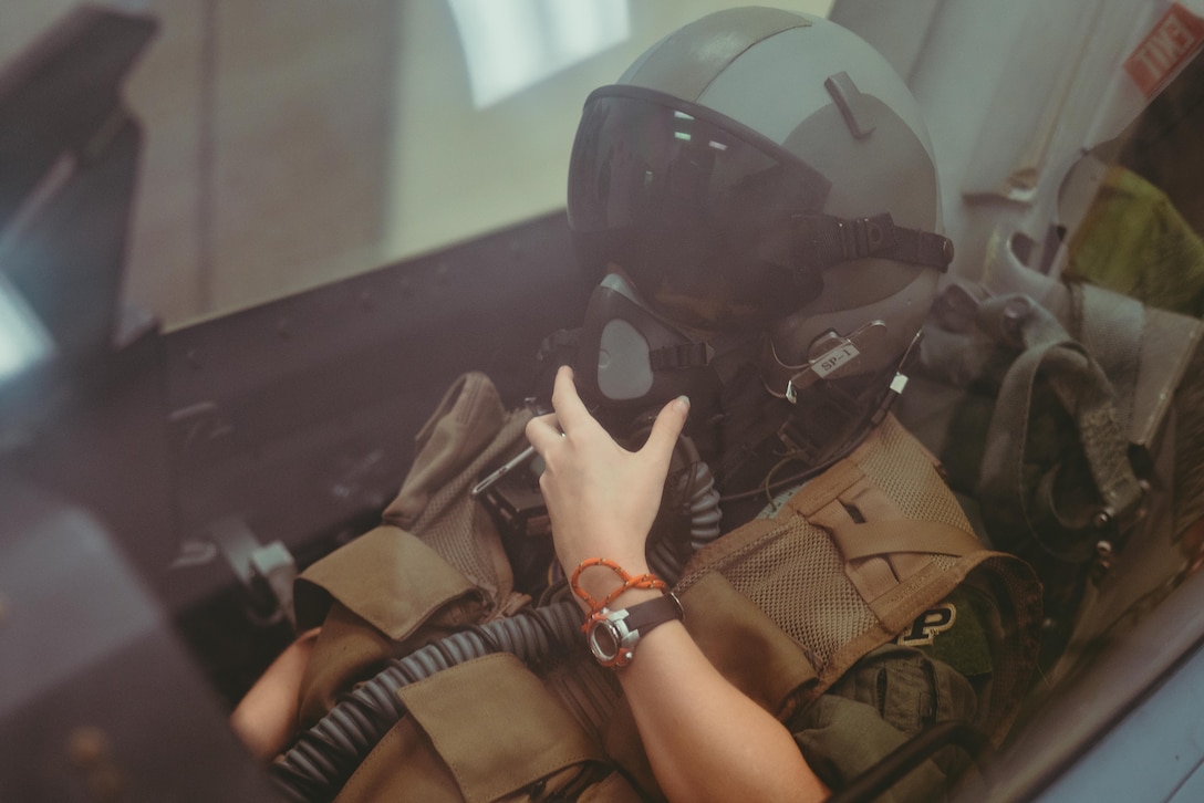 Carolyn Shaffer, Pilot for a Day participant, sits in an F-16 Fighting Falcon training system at Joint Base Andrews, Md., April 28, 2017. To honor and highlight Shaffer’s battle against cancer, JBA teamed up with the Check-6 Foundation, a local non-profit, to make her Pilot for a Day. The event is held biannually to help bring joy to the lives of children with serious illnesses. (U.S. Air Force photo by Senior Airman Delano Scott)