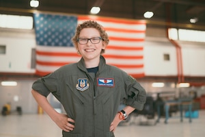 Carolyn Shaffer, Pilot for a Day participant, poses in a hangar at Joint Base Andrews, Md., April 28, 2017. To honor and highlight Shaffer’s battle against cancer, JBA teamed up with the Check-6 Foundation, a local non-profit, to make her Pilot for a Day. (U.S. Air Force photo by Senior Airman Delano Scott)