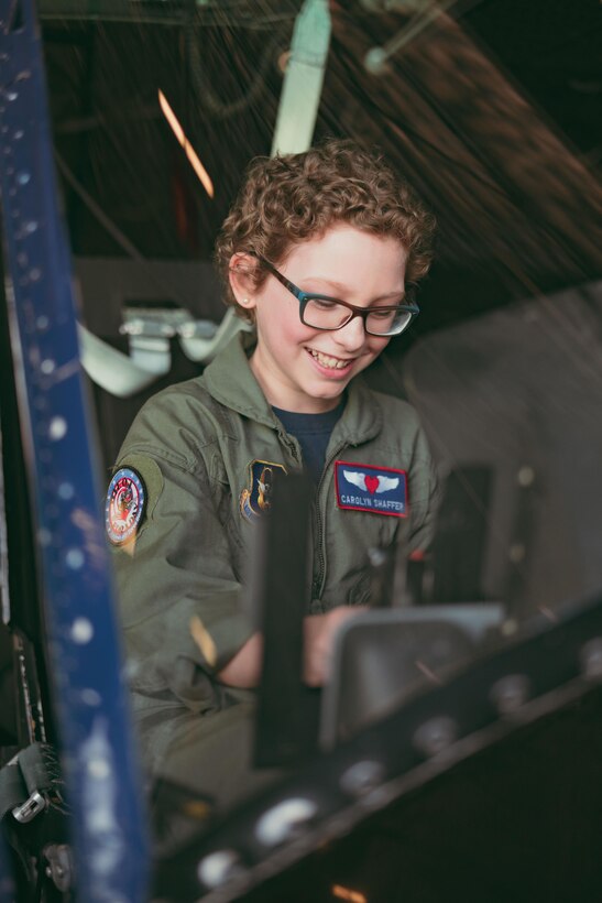 Carolyn Shaffer, Pilot for a Day participant, sits in a UH-1N Huey helicopter at Joint Base Andrews, Md., April 28, 2017. To honor and highlight Carolyn’s battle against cancer, JBA teamed up with the Check-6 Foundation, a local non-profit, to make her Pilot for a Day. (U.S. Air Force photo by Senior Airman Delano Scott)