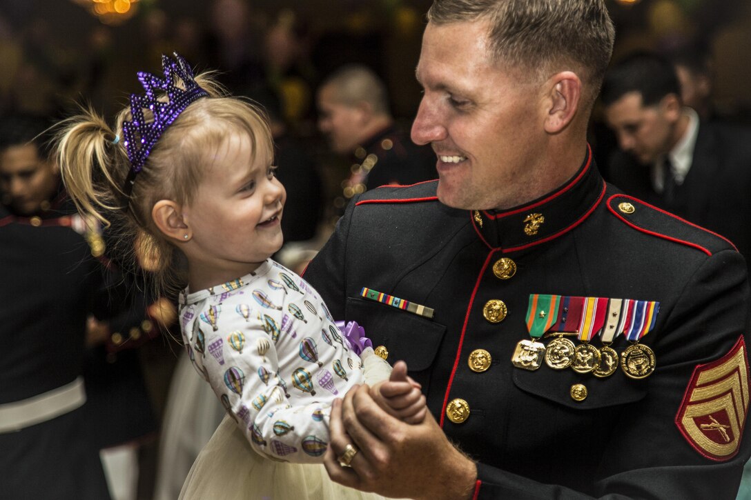 Marine Corps Staff Sgt. Christopher M. Bess dances with his 2-year-old daughter during the 11th annual father-daughter dance at Marine Corps Base Camp Pendleton, Calif., April. 28, 2017. Marine Corps photo by Lance Cpl. Michael LaFontaine Jr.