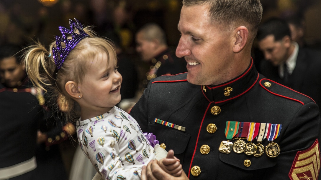 Marine Corps Staff Sgt. Christopher M. Bess dances with his 2 -year-old daughter during the 11th annual father-daughter dance at Marine Corps Base Camp Pendleton, Calif., April. 28, 2017. Marine Corps photo by Lance Cpl. Michael LaFontaine Jr.