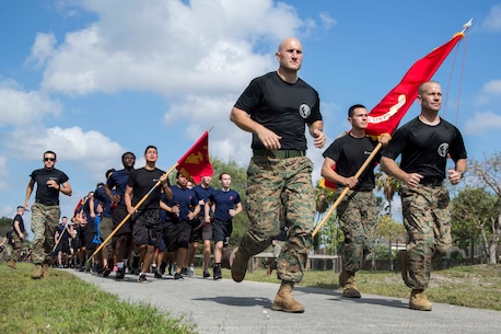 U.S. Marines and Future Marines participate in a formation run during the Recruiting Station (RS) Fort Lauderdale Annual Pool Function at Marine Corps Reserve Station Hialeah, Hialeah, Florida, Apr. 29, 2017. The annual pool function brought together every recruiting substation within RS Fort Lauderdale for a day of field meet events, friendly competition, and time with Marine Corps drill instructors. The annual function promotes camaraderie while providing Future Marines a sense of what it feels like to be a Marine recruit in the presence of drill instructors. (U.S. Marine Corps photo by Lance Cpl. Jack A. E. Rigsby/Released)