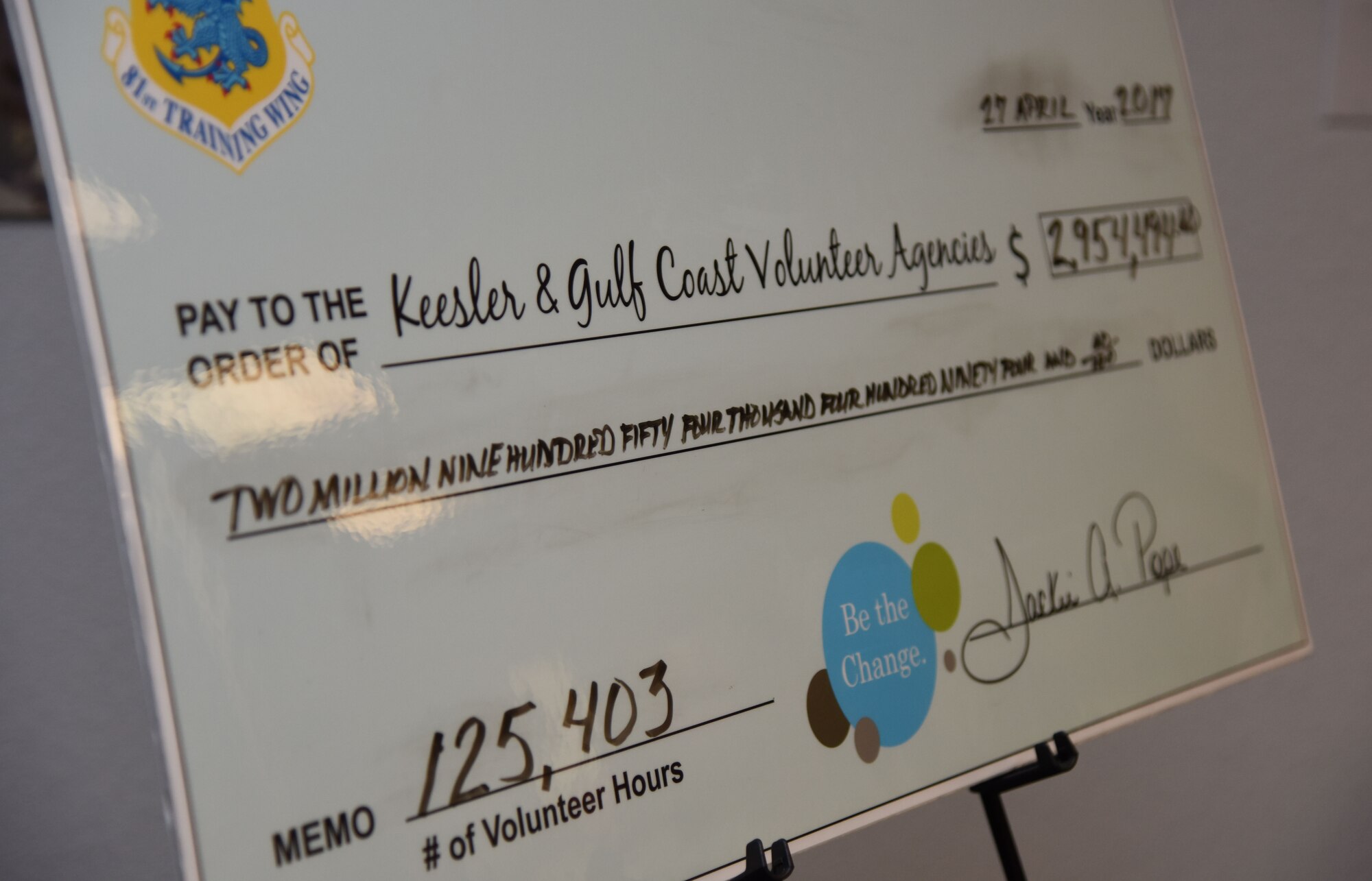 A mock check showing the value of Keesler and Gulf Coast volunteer hours donated in 2016 sits on display during the Annual Volunteer Recognition Ceremony in the Sablich Center April 27, 2017, on Keesler Air Force Base, Miss. The event recognized Keesler personnel, family member and retiree volunteers for their volunteer service in 2016. (U.S. Air Force photo by Kemberly Groue)