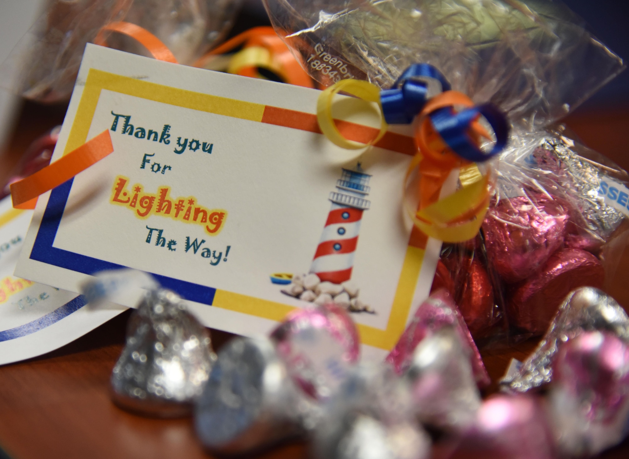 A tag and candy sit on display during the Annual Volunteer Recognition Ceremony in the Sablich Center April 27, 2017, on Keesler Air Force Base, Miss. The event recognized Keesler personnel, family member and retiree volunteers for their volunteer service in 2016. (U.S. Air Force photo by Kemberly Groue)