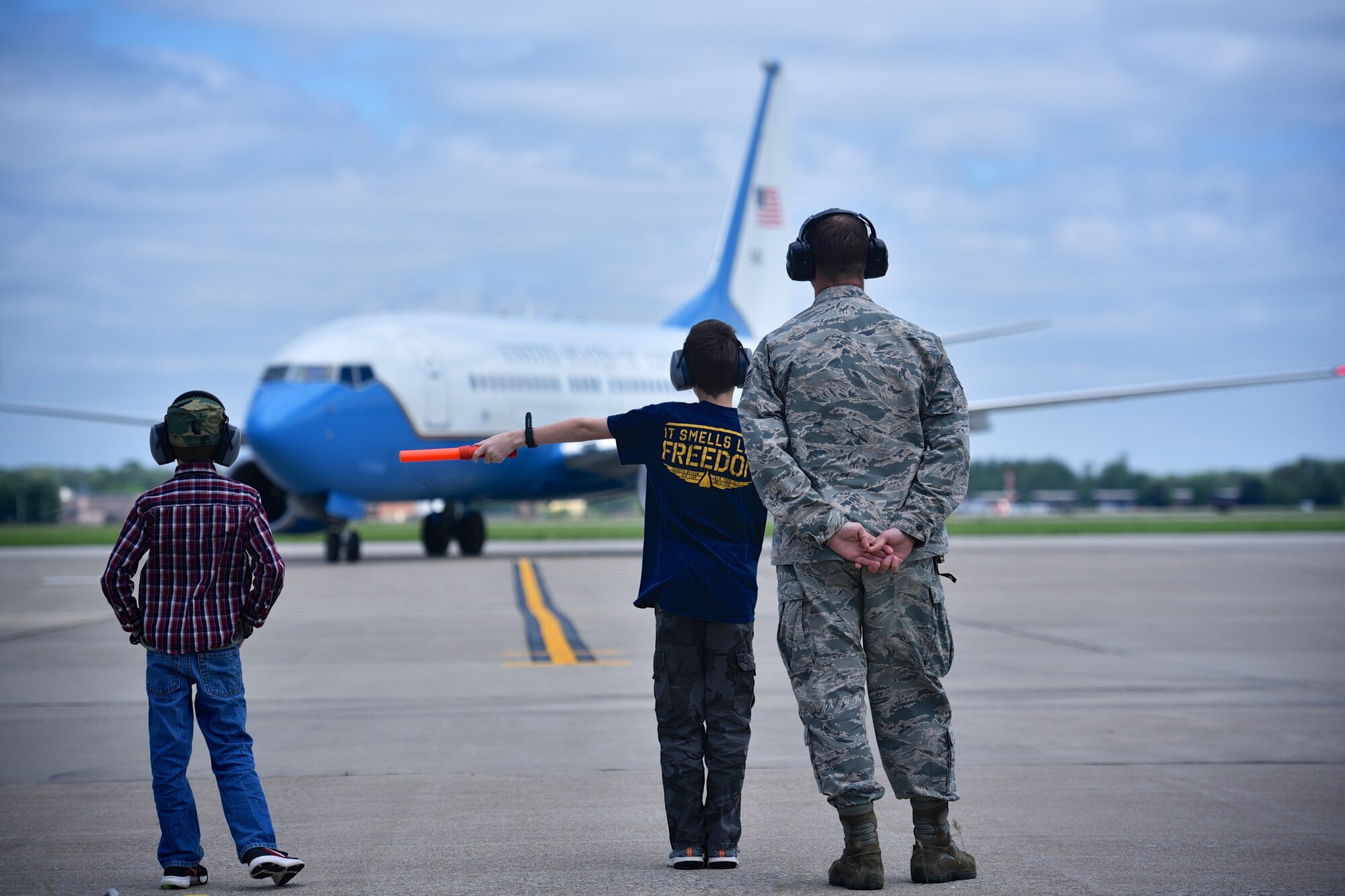 Lt. Col. Ralph "Louie" DePalma's sons help marshall him to a parking spot during his final piloting of a 932nd Airlift Wing C-40c, April 27, 2017, Scott Air Force Base, Illinois. (U.S. Air Force photo by Christopher Parr)