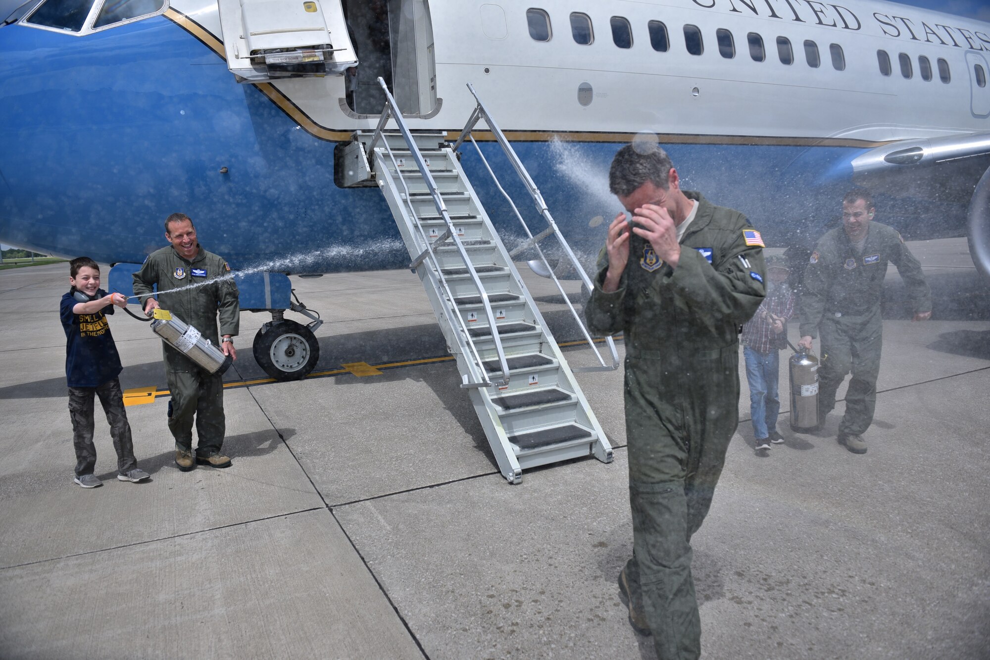 Lt Col. Ralph "Louie" DePalma gets the traditional fini-flight hose-down from his family following his final flight with the 932nd Airlift Wing at Scott Air Force Base, Illinois.  (U.S. Air Force photo by Christopher Parr)