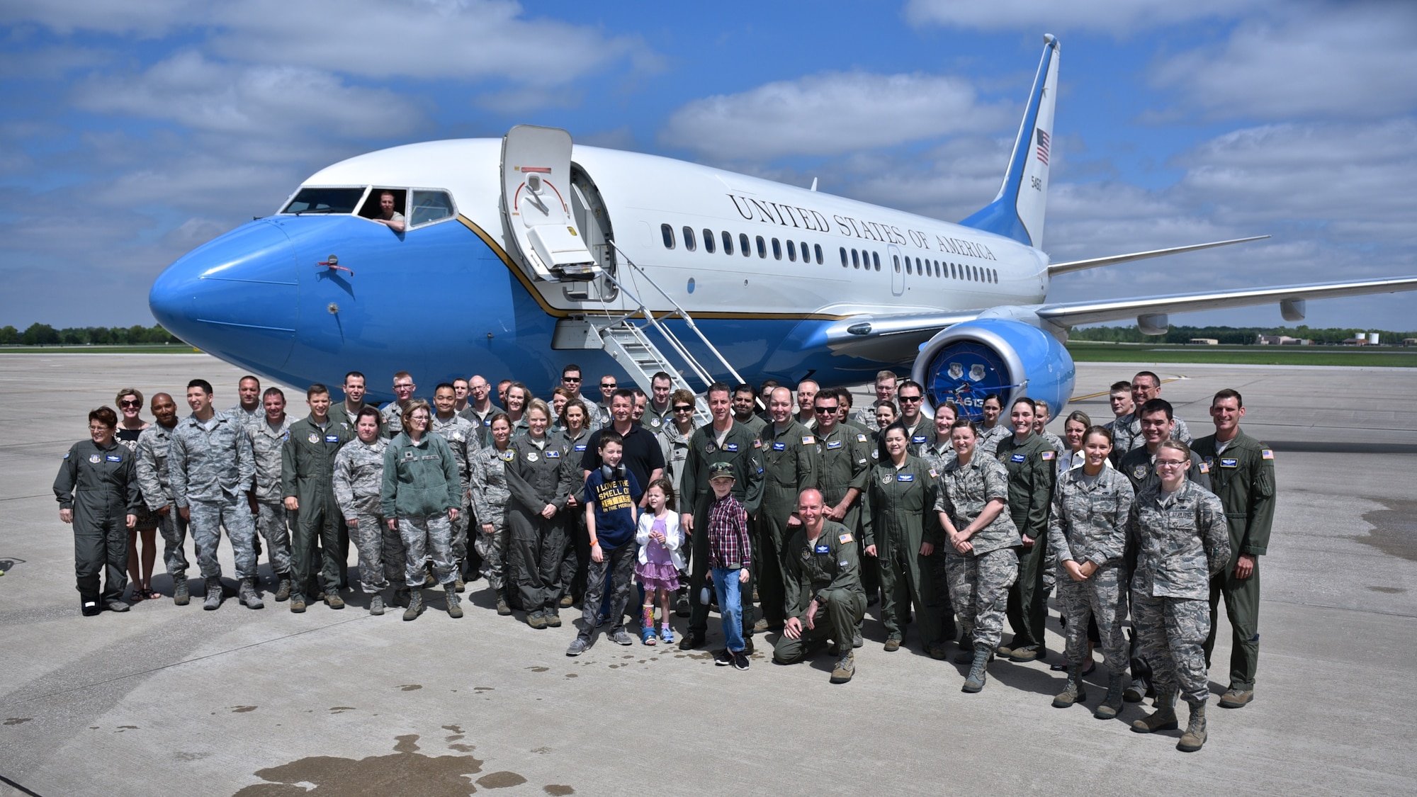 Everyone in attendance for for Lt. Col. Ralph "Louie" DeDalma's "fini" flight gather for a photo April 27, 2017, Scott Air Force Base, Illinois. (U.S. Air Force photo by Christopher Parr)