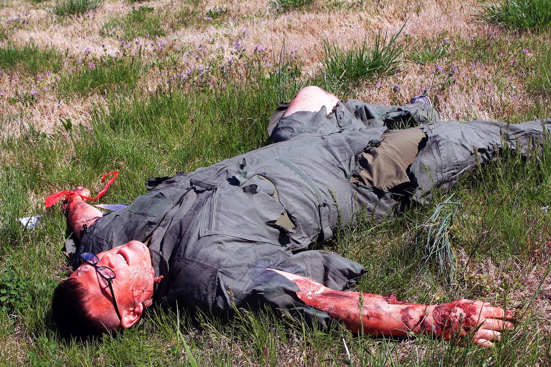 Simulated third degree burns covered more than half of this Marine's body as he laid fully aware of the crash. He was the pilot of the aircraft. As his fellow Marines cried out to him, begging him not to move, the first responders banded him with a red ribbon, therefore classifing him as high risk, high priority.