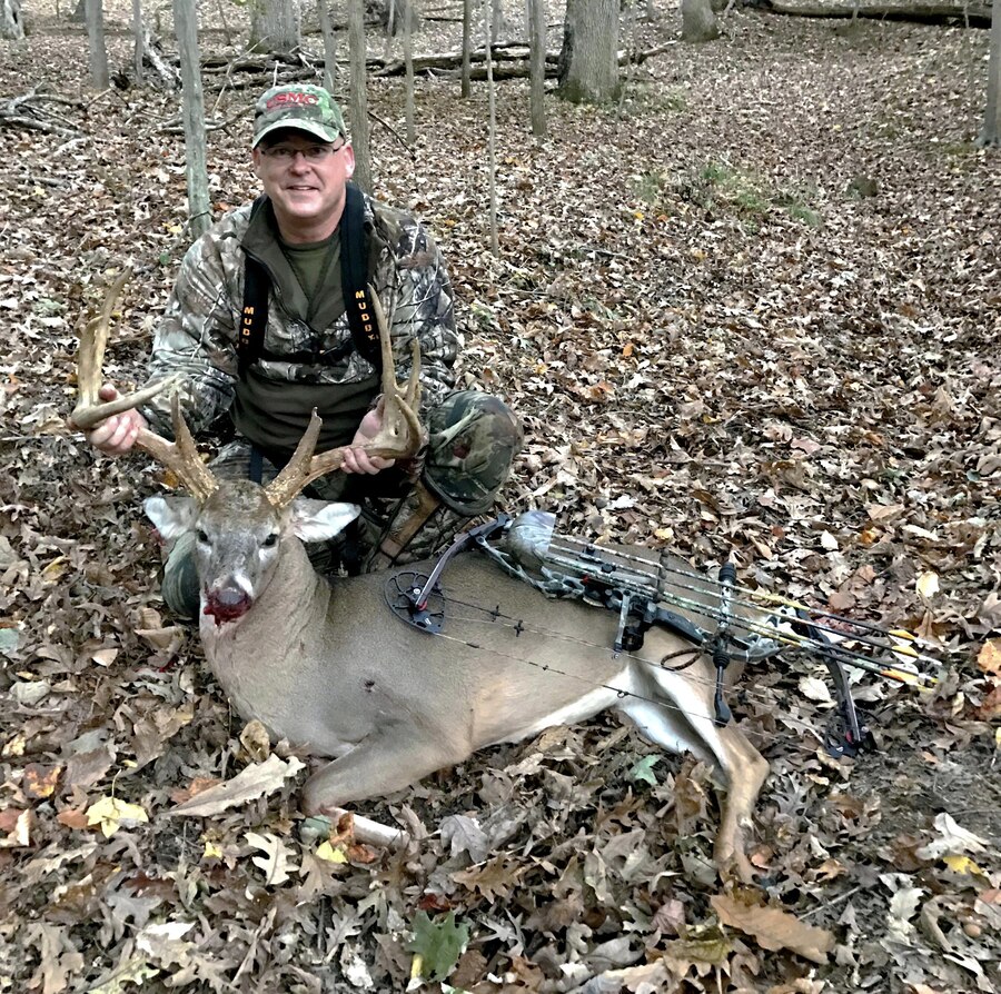 After shooting an arrow into an 11 point buck in November, Master Gunnery Sgt. Steven Butts, Sr. follows its blood trail to harvest the largest kill of the hunting season. Looking above the bucks left leg a puncture wound can be seen in its rib line.