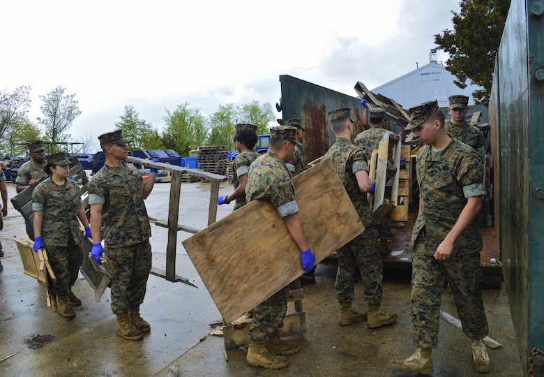 "These Marines are a true blessing," Marilisa Porter, recycling manager at Quantico Marine Corps Base Recycling Facility said as Marines hauled an array of retired wood from around base in preperation for Earth Day, April 22. This was done to help Natural Resources and Environmental Affairs further beautify the base.