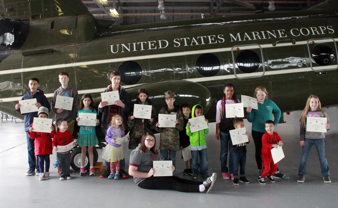 The children were awarded honorary certificates for their particpation in the Bring Your Kids to Work Day event in which each certificate had their parent's Military Occupational Specialty.