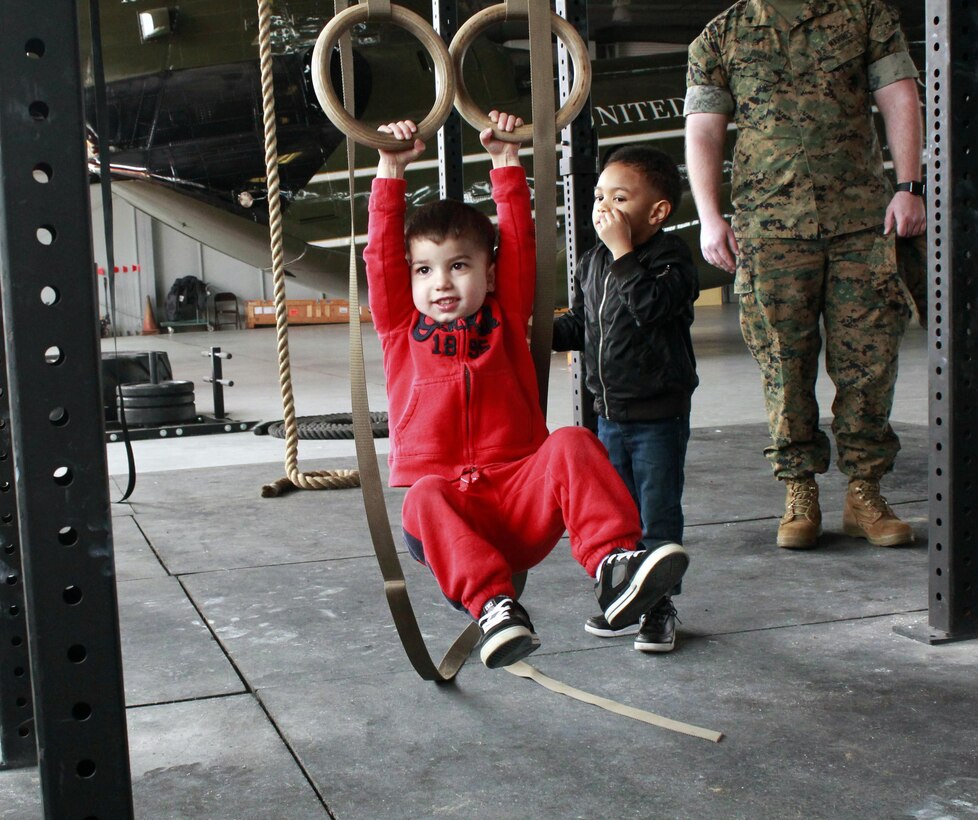 Gavin literally hangs out in the hanger as he swings back and forth on the rings.