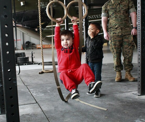 Gavin literally hangs out in the hanger as he swings back and forth on the rings.