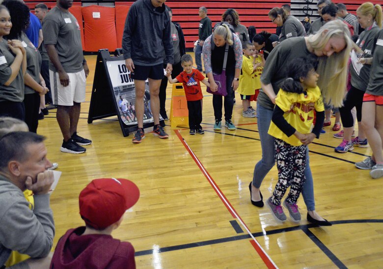 For some Exceptional Family Member Program Special Olympic volunteers they were the hands and feet for the athletes that were unable to fully particpate in the event. Cassidy, a volunteer at the event had been at this Olympians side every step, jump and toss of the way.