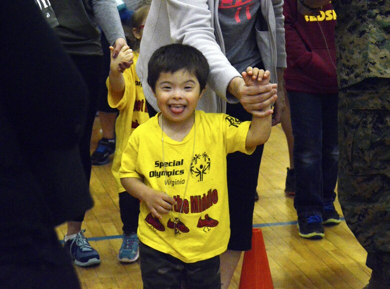 This Special Olympian smiles for the camera after receiving his EFMP Special Olympic Medal for outstanding participation.