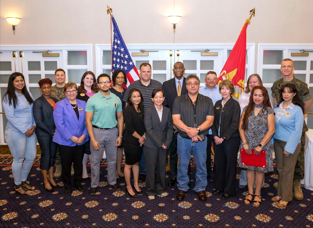 Marine Corps Base Quantico celebrated the Civillian of the Quarter and Length of Service Awards April 6, in which 73 employees were recognized for their dedication to the base.

First Row: Matysabel Zorilla (MCCS: 5 Years), Raquel Peacock (MCCS: 10 Years), Maryellen Farley (MCCS: 10 Years), Atrayo Harper (MCCS: 5 Years), Ruby Moore (MCCS: 5 Years), Joy Hughes (RCO: 5 Years), Peter Canciglia (Junior Civilian of the Quarter, Ann White (MCCS: 20 Years),  Florencia Contreras (MCCS: 20 Years) and Cathy Delossantoscoy (MCCS: 20 Years)

Second Row:Jenna Wallace (MCCS: 5 Years), Tammie Washington (G-6: 20 Years), Nathan Tabor (G-6: 20 Years), Cedric Overton (MCCS: 25 Years) and Allan Mitchell (GF: 35 Years), Sharlsie Medina (HQBN: 30 Years)