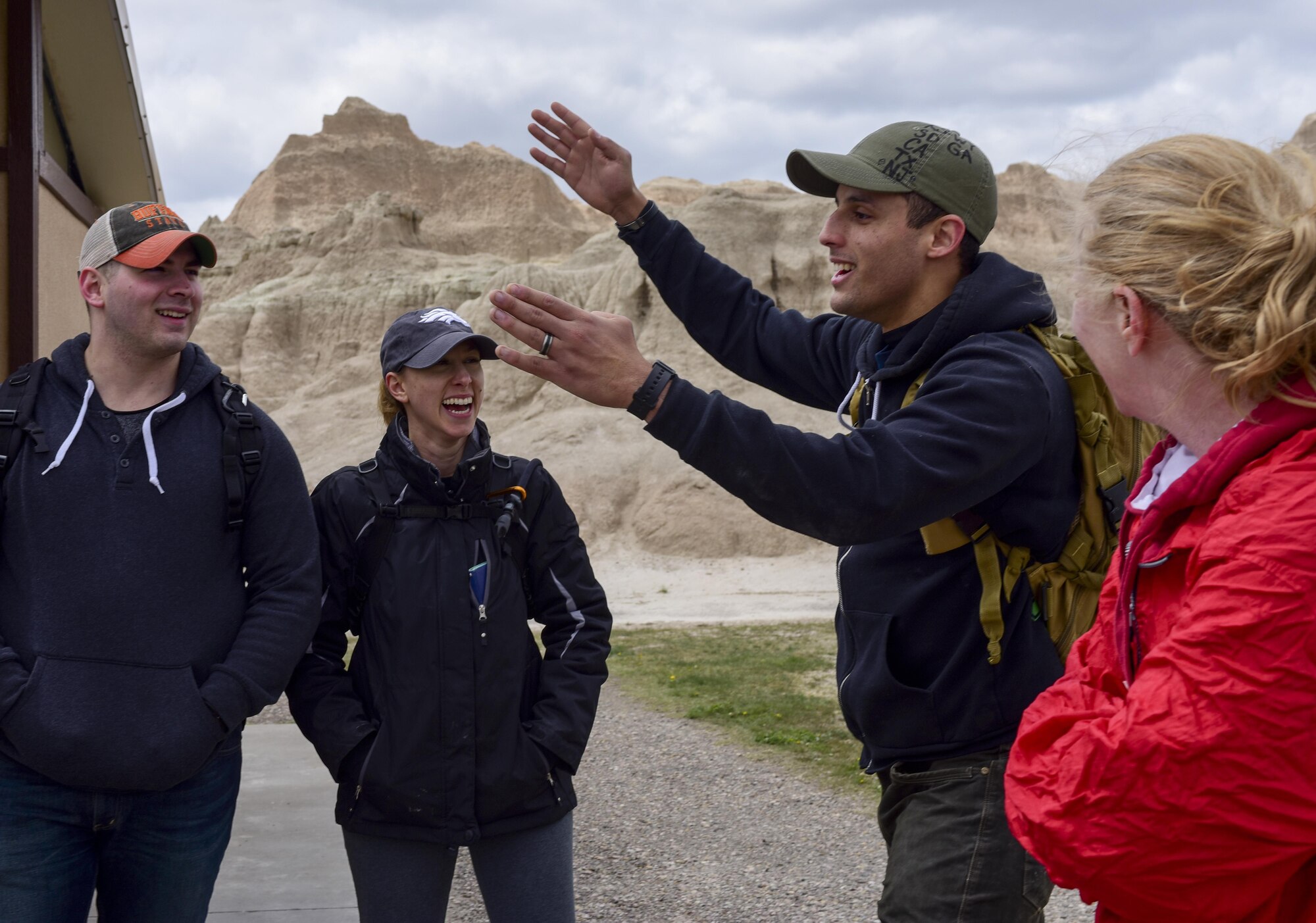 Airmen trade stories after a hike through the Badlands National Park, S.D., April 28, 2017. The hike was one of several activities Ellsworth Airmen participated in during a semi-annual Wingman Day that focused on improving Airmen both physically and socially. (U.S. Air Force photo by Airman 1st Class Randahl J. Jenson)