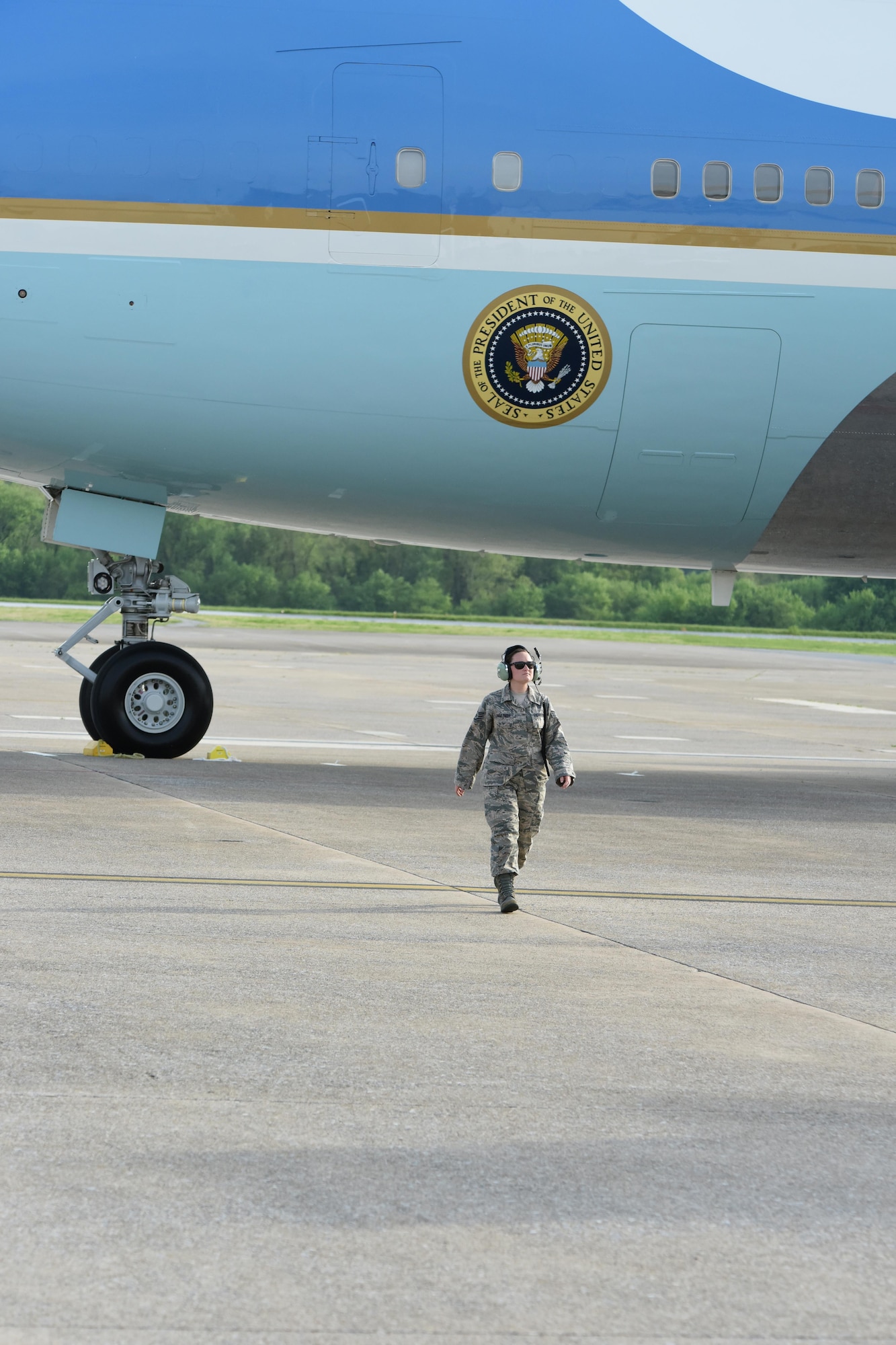 Staff Sgt. Katelyn Zimmerman, 193rd Special Operations Wing instruments and flight controls system specialist, walks away from Air Force One after chalking the front wheels once it landed at the 193rd SOW, Middletown, Pennsylvania, April 29, 2017. President Donald J. Trump and Vice President Mike Pence; whom landed earlier, were on their way to the Harrisburg Farm Show Complex for President Trump’s 100th day rally. (U.S. Air National Guard Photo by Master Sgt. Culeen Shaffer/Released)