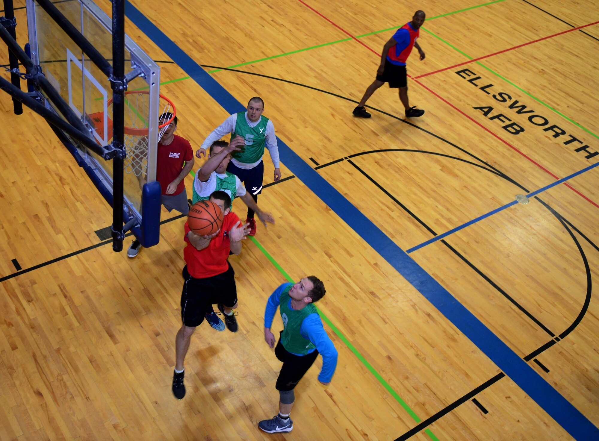 Airmen compete in a game of basketball during a semi-annual Wingman Day at Ellsworth Air Force Base, S.D., April 28, 2017. Events included hiking, paintball, basketball and other sporting activities that focused on developing Airmen physically and socially. (U.S. Air Force photo by Airman 1st Class Donald C. Knechtel)