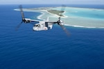 An MV-22B Osprey, assigned to Marine Medium Tiltrotor Squadron (VMM) 163 (Reinforced), embarked aboard the amphibious assault ship USS Makin Island (LHD 8), flies past Wake Island, April 24, 2017. Makin Island, the flagship for the Makin Island Amphibious Ready Group, with the embarked 11th Marine Expeditionary Unit, is operating in the Pacific Ocean to enhance amphibious capability with regional partners and to serve as a ready-response force for any type of contingency. 