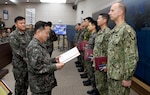 Republic of Korea (ROK) Army Gen. Lee, Sun-jin, chairman of the ROK joint chiefs of staff presents an award to Cmdr. David Suchyta, operations department assistant chief of staff for Commander, U.S. Naval Forces Korea (CNFK) during a visit to ROK Fleet headquarters and CNFK headquarters in Busan, May 2, 2017. CNFK is the U.S. Navy's representative in the ROK, providing leadership and expertise in naval matters to improve institutional and operational effectiveness between the two navies and to strengthen collective security efforts in Korea and the region. 