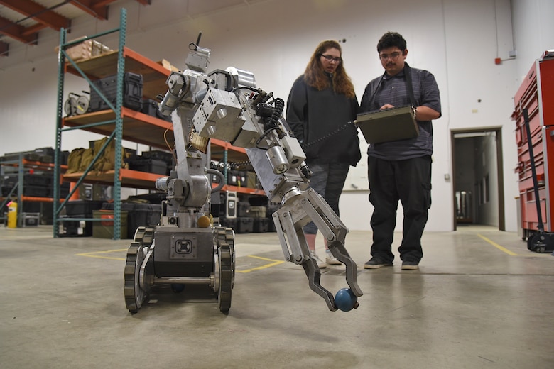 Paideia High School students operate a robot during a Science, Technology, Engineering and Math tour hosted by the 92nd Civil Engineer Squadron May 1, 2017, at Fairchild Air Force Base, Washington. The students were exposed to numerous forms of engineering including civil, geotechnical, structural, environmental and mechanical. (U.S. Air Force photo/Senior Airman Mackenzie Richardson)
