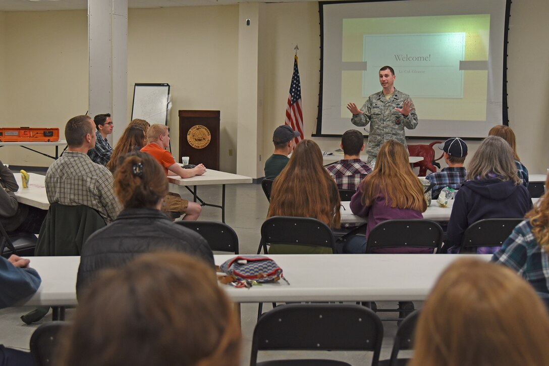 Lt. Col. Ross Gleason, 92nd Civil Engineer Squadron commander, welcomes local high school students to the base at the beginning of a Science, Technology, Engineering and Math tour May 1, 2017, at Fairchild Air Force Base, Washington. The students were exposed to numerous forms of engineering including civil, geotechnical, structural, environmental and mechanical. (U.S. Air Force photo/Senior Airman Mackenzie Richardson)