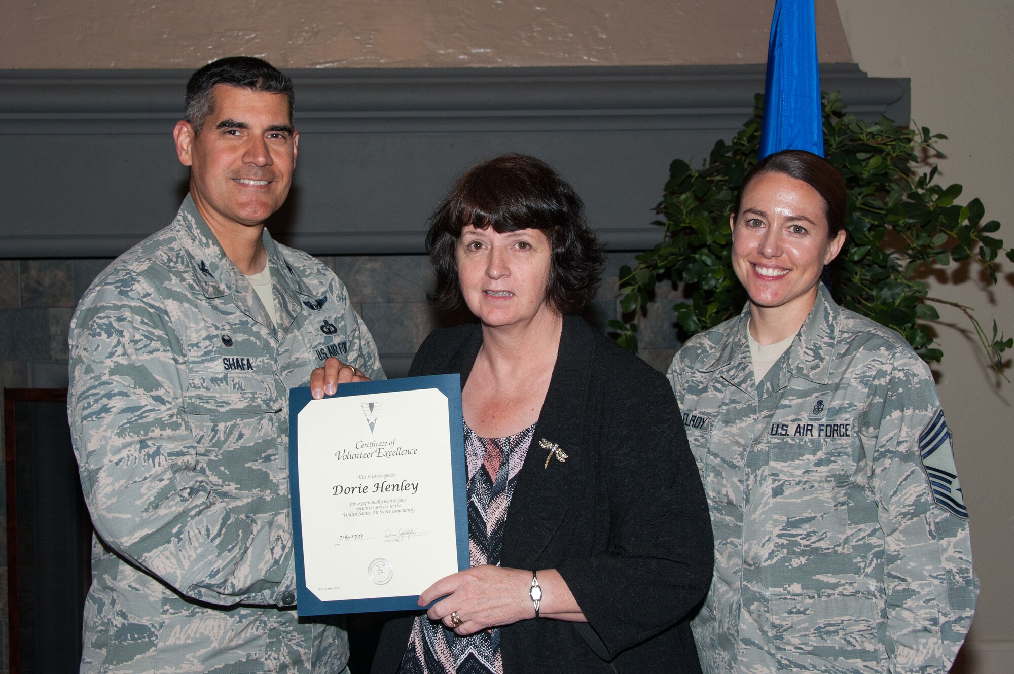 Col. Eric Shafa, 42nd Air Base Wing commander, presents Dorie Henley with the Volunteer Excellence Award on Maxwell Air Force Base, Ala., April 27, 2017.  All of the 2016 volunteers were recognized for their service and awarded certificates. (US Air Force photo by Bud Hancock)