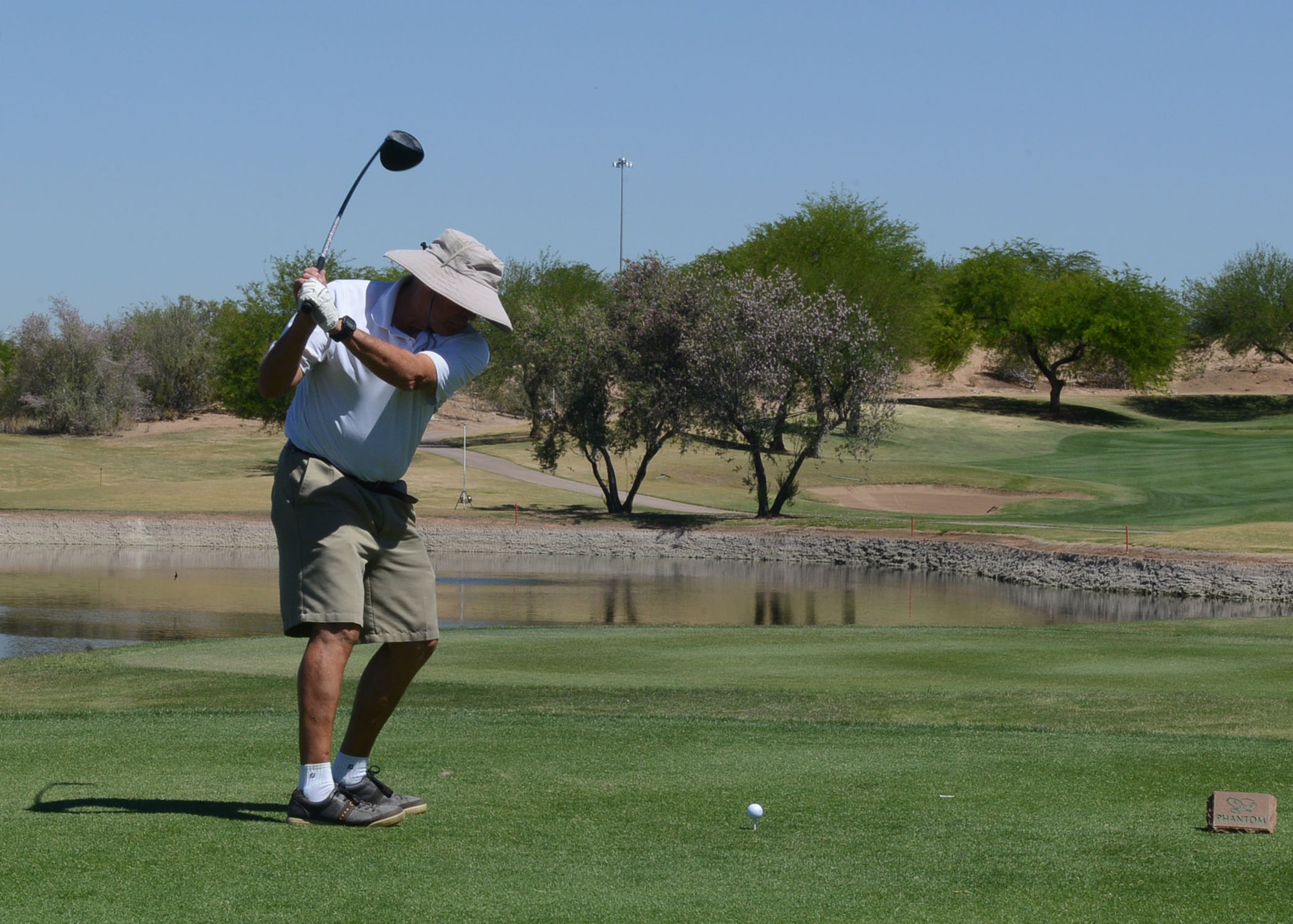 Retired Army Maj. Dick Lattin swings a golf club May 1, 2017, on Falcon Dunes Golf Course at Luke Air Force Base, Ariz. The Falcon Dunes Golf Course is open to the public May 1 through September 30. (U.S. Air Force photo by Senior Airman James Hensley)