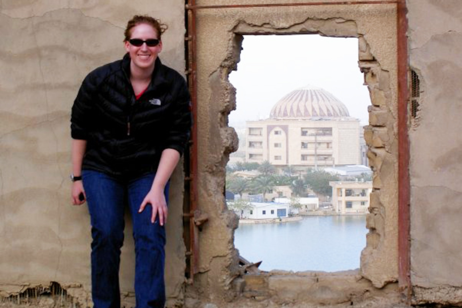 Rachel Kesselman in Iraq with the Perfume Palace in the distance. 