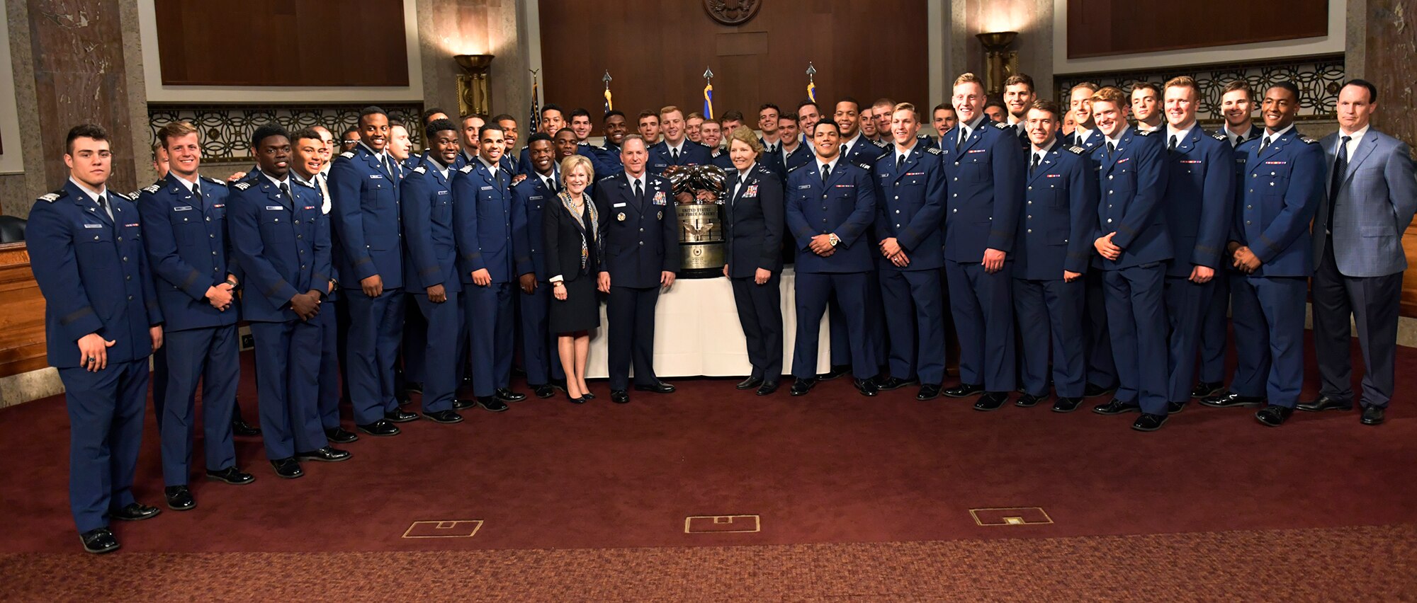 Air Force Chief of Staff Gen. David L. Goldfein, his wife Dawn and Air Force Academy Superintendent Lt. Gen. Michelle Johnson pose for a photo during the Congressional social congratulating the U.S. Air Force Academy football team for winning the Commander in Chief’s Trophy, at the Dirkson Senate Office Building in Washington, D.C., May 1, 2017. (U.S. Air Force photo/Wayne A. Clark)