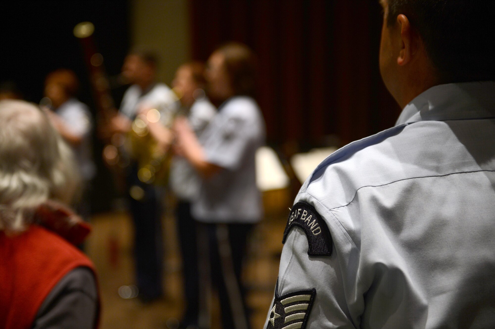 Tech. Sgt. Andrew Tucker, U.S. Air Force Band of the Golden West percussion player, stands at attention during the national anthem, performed by the Golden West Winds, May 1, 2017 in Seattle, Wash. While on tour in Washington, the Golden West Winds performed at Kent United Methodist Church and the Seattle Public Library. (U.S. Air Force photo/Senior Airman Divine Cox)