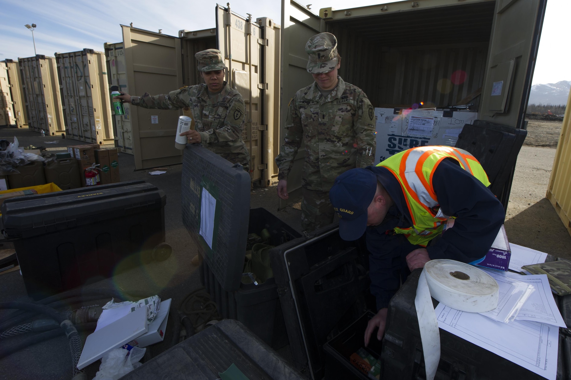 U.S. Coast Guard Marine Science Technician Petty Officer 1st Class Gary Bullock inspects undeclared hazmat materials inside a cargo before shipping the container to Fort Polk, Louisiana from Joint Base Elmendorf-Richardson, Alaska, May 2, 2017. The 4th Brigade Combat Team (Airborne), 25th Infantry Division will conduct a rotation at the Joint Readiness Training Center at Fort Polk. Bullock is assigned to the Coast Guard Marine Safety Detachment Homer. (U.S. Air Force photo by Staff Sgt. Sheila deVera)