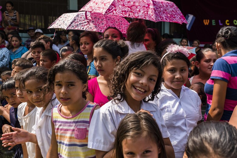 Villagers of San Jerónimo, Comayagua, Honduras wait for more than 190 members of Joint Task Force-Bravo to hiked approximately 3.6 miles round-trip to the village, Apr. 29, 2017. Members carried more than 5025 lbs of food and supplies, 24 soccer balls and 3 piñatas to the people of San Jerónimo. Chapel hikes have been occurring since 2003, with the JTF-Bravo Chapel sponsoring an average of six every year. The hikes are designed to provide a practical way for JTF-Bravo members to engage and partner with local communities to provide support to surrounding villages in need of food and supplies. (U.S. Air National Guard photo by Master Sgt. Scott Thompson/released)