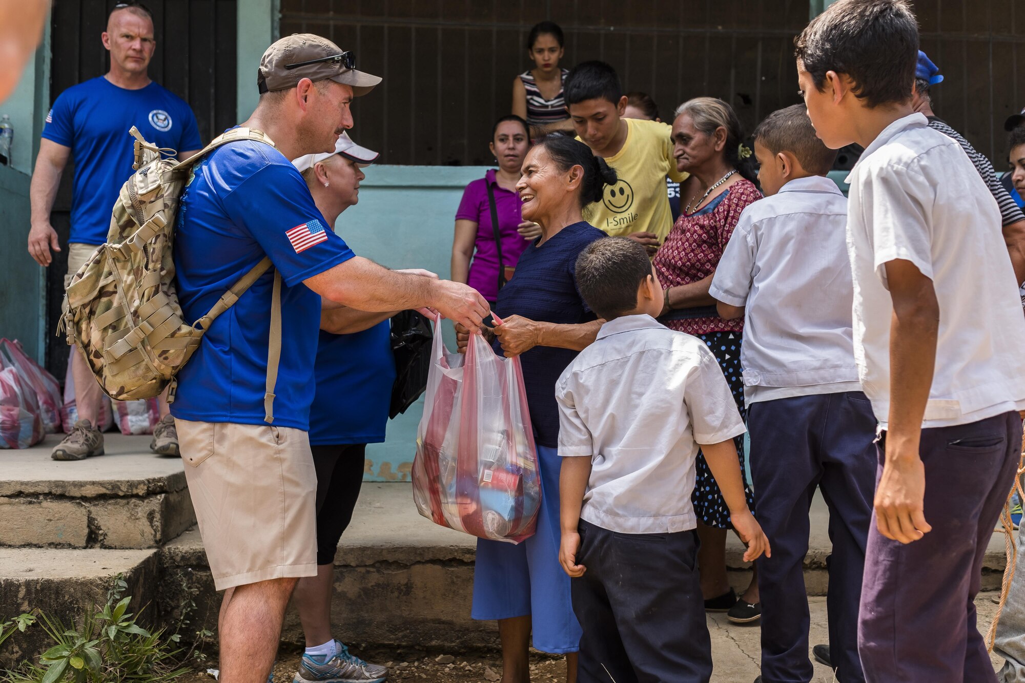 Villagers of San Jerónimo, Comayagua, Honduras receive bags of food from more than 190 members of Joint Task Force-Bravo to hiked approximately 3.6 miles round-trip to the village, Apr. 29, 2017. Members carried more than 5025 lbs of food and supplies, 24 soccer balls and 3 piñatas to the people of San Jerónimo. Chapel hikes have been occurring since 2003, with the JTF-Bravo Chapel sponsoring an average of six every year. The hikes are designed to provide a practical way for JTF-Bravo members to engage and partner with local communities to provide support to surrounding villages in need of food and supplies. (U.S. Air National Guard photo by Master Sgt. Scott Thompson/released)