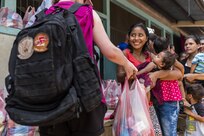Villagers of San Jerónimo, Comayagua, Honduras receive bags of food from more than 190 members of Joint Task Force-Bravo who hiked approximately 3.6 miles round-trip to the village, Apr. 29, 2017. Members carried more than 5025 lbs of food and supplies, 24 soccer balls and 3 piñatas to the people of San Jerónimo. Chapel hikes have been occurring since 2003, with the JTF-Bravo Chapel sponsoring an average of six every year. The hikes are designed to provide a way for JTF-Bravo members to engage and partner with local communities and provide support to surrounding villages in need of food and supplies. (U.S. Air National Guard photo by Master Sgt. Scott Thompson/released)