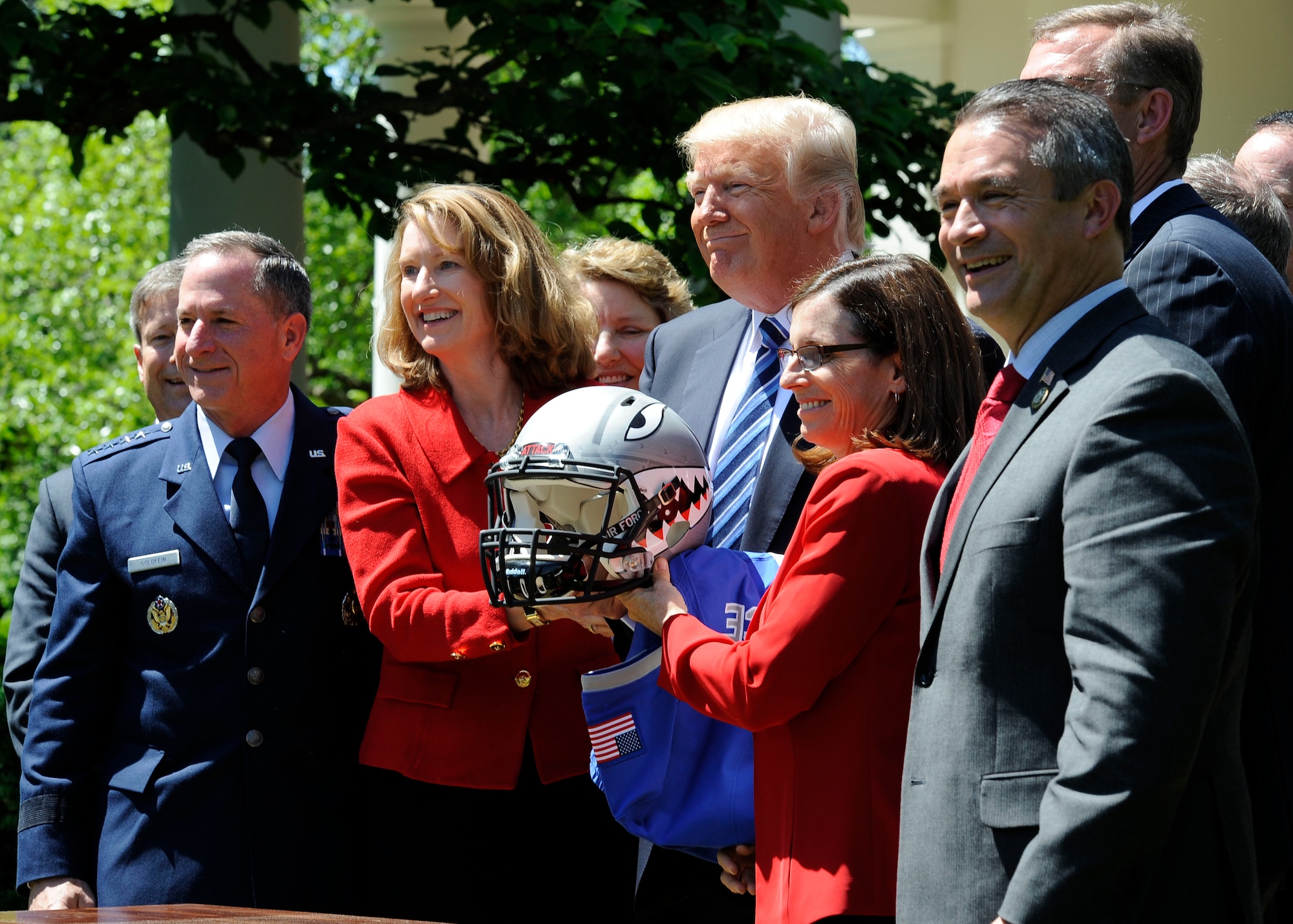 Air Force Chief of Staff Gen. David L. Goldfein, (left), and Acting Secretary of the Air Force Lisa S. Disbrow pose for a photo with President Donald Trump at the White House, May 2, 2017. Trump congratulated the U.S. Air Force Academy football team with the Commander -in -Chief's Trophy. (U.S. Air Force photo/Staff Sgt. Jannelle McRae)
