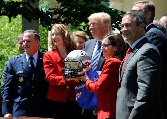 Air Force Chief of Staff Gen. David L. Goldfein, (left), and Acting Secretary of the Air Force Lisa S. Disbrow pose for a photo with President Donald Trump at the White House, May 2, 2017. Trump congratulated the U.S. Air Force Academy football team with the Commander -in -Chief's Trophy. (U.S. Air Force photo/Staff Sgt. Jannelle McRae)