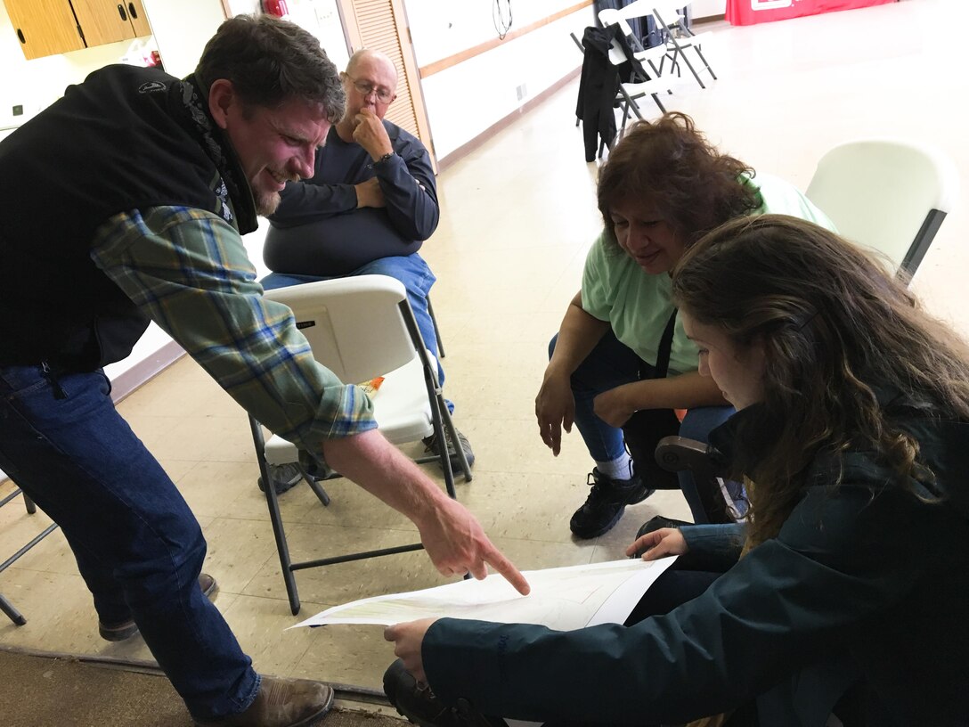 Sacramento District Water Resources Planners Hunter Merritt, far right, and Patricia Fontanet, second from right, meet with members of the Skull Valley Reservation community during an outreach event held on the reservation in April. 